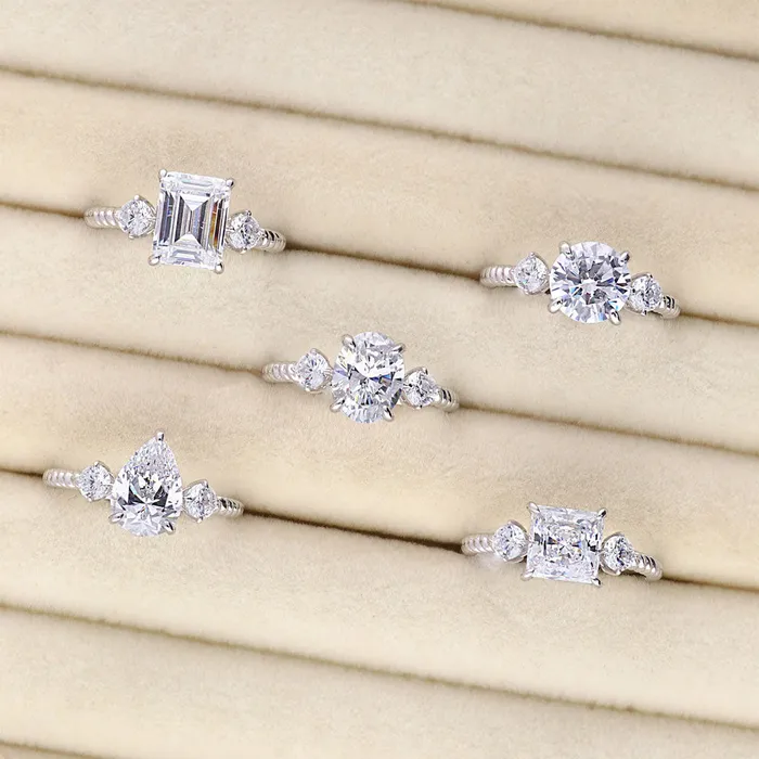 BERRICLE Rings 3Stone Woven 26ct Emerald Cut CZ Ring in Sterling Silver